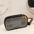 Detail of a large capacity black pencil case with transparent mesh window and dual gold zippers - Black