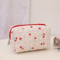 Close-up of quilted floral cosmetic bag with pink and green plaid pattern and red zipper - Watermelon Red Makeup Bag