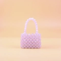 Handgefertigte, irisierende lila Mini-Perlentasche mit Griff für einen schicken Look - Rosa