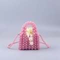 Pink handmade pearl beaded handbag with drawstring satin lining and crossbody strap - Pink