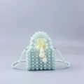 Detail of handmade blue and white pearl beaded bag with satin drawstring liner - Green