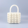 Elegant white beaded pearl handbag with woven texture and matching pearl handle - White