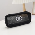 Zwarte mesh etui met grote ogen borduursel op bureau met lamp en houten frame - Zwart