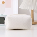 Close-up of white checkerboard textured pencil case with high-quality zipper detail - White