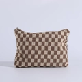 Detail of soft knit checkered makeup bag with brown weave texture and zip closure - Khaki Plaid