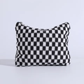 Detail view of the soft knitted checkered makeup bag with durable silver metal zipper - Black and White Plaid
