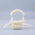Elegant beaded pearl handbag with fixed handle and detachable long chain shoulder strap - Milky White