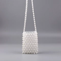 Detail of handmade beaded crossbody phone bag with clear acrylic and white pearls - Transparent + Pearl