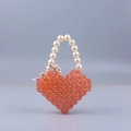 Handmade orange acrylic heart-shaped beaded handbag with elegant pearl handle for parties - Orange + White