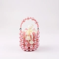 Detailed view of pink pearl beaded bucket bag with white satin drawstring lining and bow - Pink