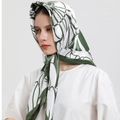 Elegant satin silk scarf with green geometric pattern tied as a stylish headwrap - S162 Green