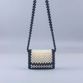 Detail of handmade beaded crossbody bag with black and white pearl weave texture - Black Body with White Edge