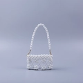 Handmade pearl beaded mini handbag featuring hollow petal patterns for evening parties - White