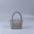 Handmade woven silver pearl evening bag with U-shaped handle and metallic finish beads - Silver