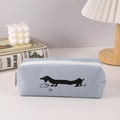 Detail of light blue pencil case with black dachshund print on a cozy aesthetic desk - Denim Blue Dachshund Pencil Case