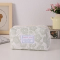 Detail of floral quilted cosmetic bag with sweet girl label and green flower pattern - Green with Flower