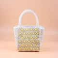 Macro detail of hand-beaded tote with cream pearls and bright yellow acrylic flowers - Light Yellow