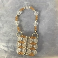 Handmade beaded mini bag pendant featuring transparent and amber multi-faceted beads - Orange