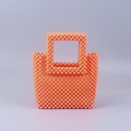 Detailed view of handmade orange acrylic beaded handbag with woven grid pattern - Orange