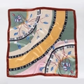 Detailed flat lay of a 90cm square silk scarf with floral prints and geometric patterns - Dark Green Gold Mix