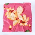 Close-up of pink satin square scarf featuring elegant yellow lily floral print texture - Rose Red with Lily