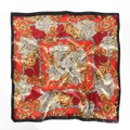 Detailed macro view of baroque paisley silk scarf featuring gold patterns on red satin - 90x90cm / Burgundy