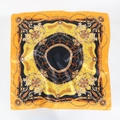 Detail of satin square scarf with vintage chain and gold buckle print in orange and black - Black Gold