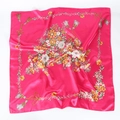 Close-up of fuchsia satin square scarf with elegant floral prints and golden tassel details - 90x90cm / Rose Red