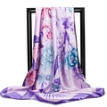 Ink wash floral silk scarf with large purple and pink blossoms on a black metal hanger - Purple Edge