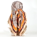 90cm paisley satin square scarf in orange and brown tones worn as a stylish headscarf - 90x90cm / Orange