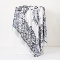 Detail of satin floral paisley scarf draped over minimalist stone props - 90cm / Classic Paisley Grey-White