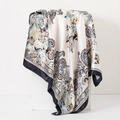 Detail of vintage paisley and floral print silk scarf draped on a white display stand - 90cm / Classic Paisley Black & White