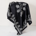 Detail of black silk scarf with white paisley pattern showing smooth satin texture - 90cm / Paisley K Black