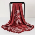 Detail of red and white paisley silk scarf showing smooth texture and elegant drape - 90x90cm / Burgundy