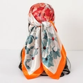 Fashionable floral satin scarf worn as a hair wrap in vibrant orange and blue floral pattern - 90x90cm / Orange Floral
