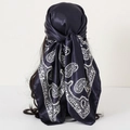 Dark blue satin scarf with white paisley pattern worn on hair for a retro look - 90x90cm / Black Paisley