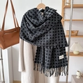 Thick black and white plaid cashmere-like scarf with tassels on beige coat - Black