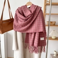 Detail of pink plaid cashmere scarf with tassel fringe and Yashang label on beige coat - Dusky Pink
