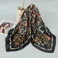 Elegant black silk-like satin square scarf with colorful paisley floral patterns on a bag - Black Paisley