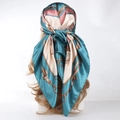Polka dot satin square scarf with gold chain print in teal and beige worn as headscarf - Emerald Chain