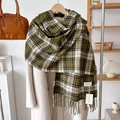Detail of green plaid cashmere scarf with soft tassels and brand label on a wooden hanger - Over 175cm / Green Beige