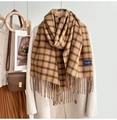 Detailed view of camel plaid scarf with soft tassels and warm woolen texture - Light Coffee