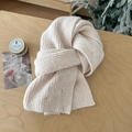 Cream chunky wool blend knit scarf with elegant bow embroidery in a cozy setting - Off White