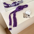 Slim purple cable-knit scarf with decorative white label in a stylish knotted display - Purple