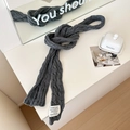 Dark grey cable knit scarf featuring a minimalist weave and a stylish white fabric label - Gray