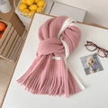 Pink and white mohair scarf with knitted texture and brand label in flat lay style - Pink