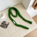 Green 100% wool knit skinny scarf with chunky texture on a minimalist background - Grass Green