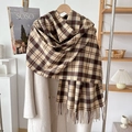 Close-up of brown and beige plaid scarf with fringe detail on a cream wool coat - Khaki Coffee Block Plaid