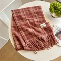 Cozy pink plaid scarf with tassels and fabric label on a white table setting - Dusky Pink