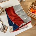 Detail of 100% Australian wool scarf featuring colorful knit blocks and luxury brand label - 135-175CM / Brick Red Gray
